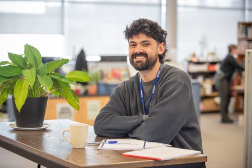 A case manager smiling at the camera